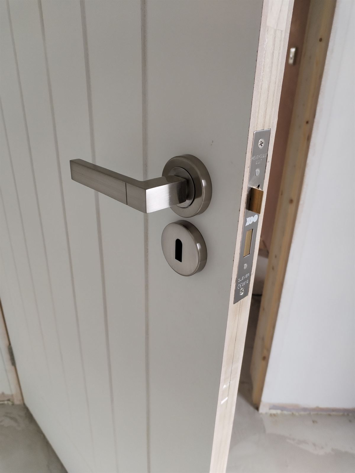 New door with brushed steel handle and mortice lock fitted